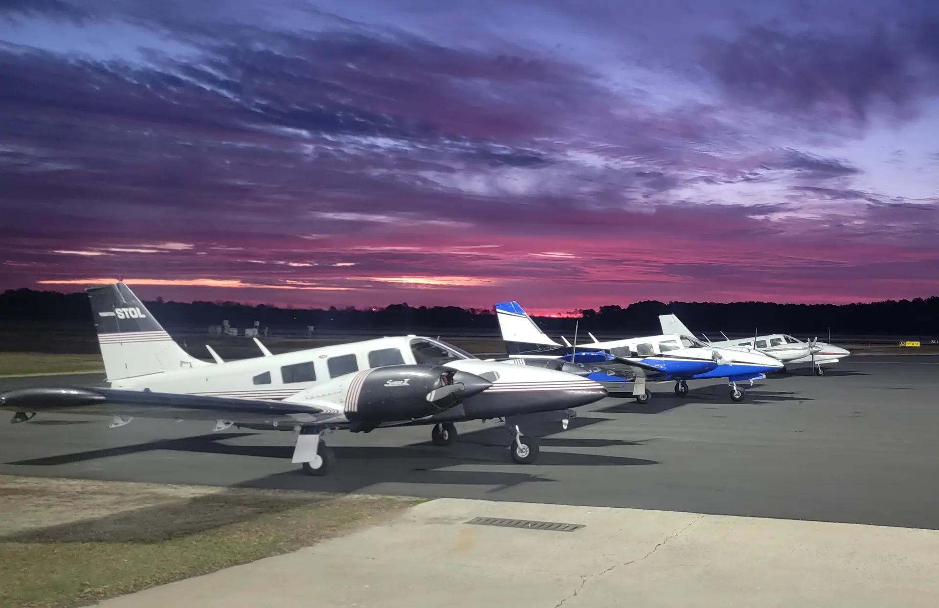 Instructor and student pre-flighting a multi-engine aircraft