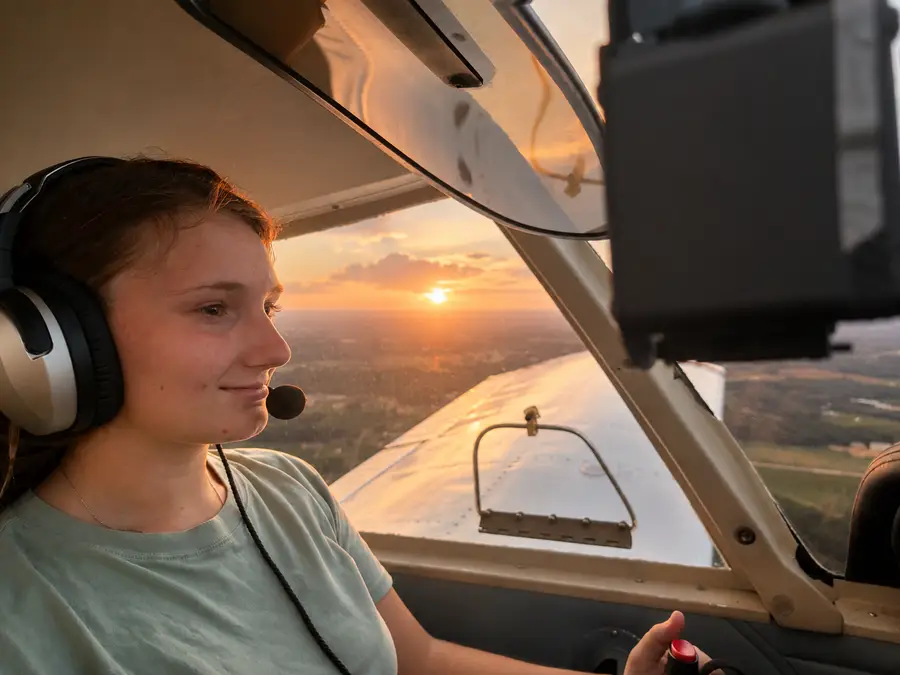 Savanna H. pilot student inside cockpit with horizon in the background at M2A Aviation Academy