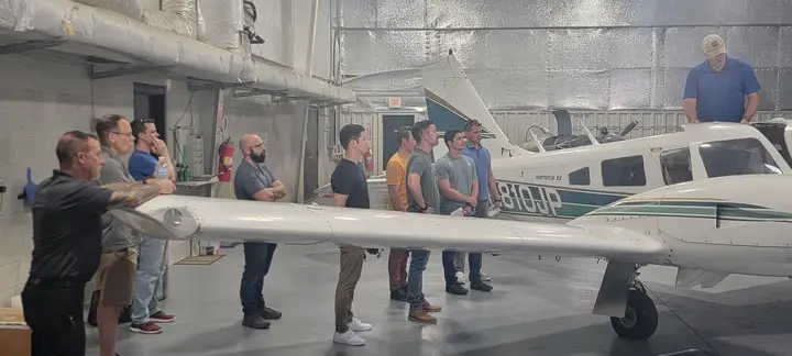 M2A Aviation Academy students studying inside the hangar