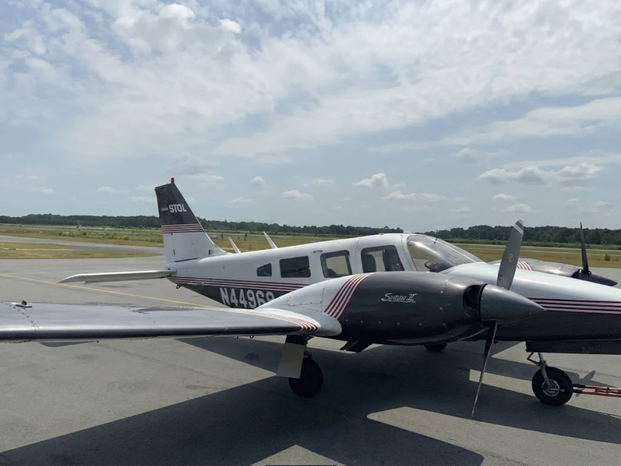 Piper Cherokee fleet lined up on the flight line at M2A Aviation Academy